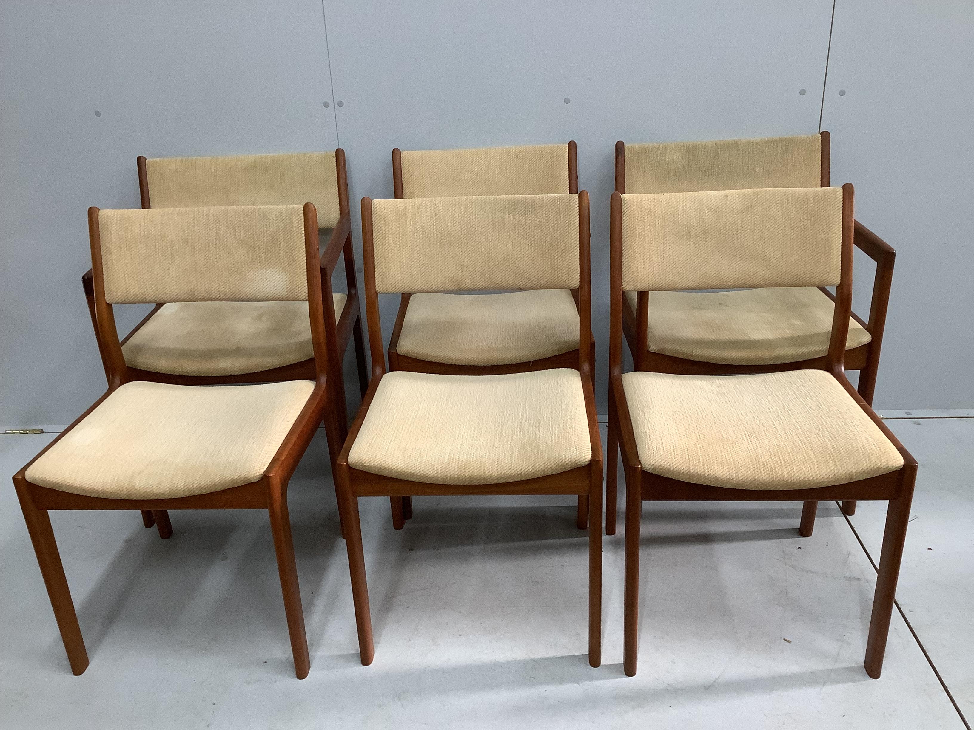 A mid century teak extending dining table, length 150cm, width 106cm, height 74cm and six chairs, two with arms